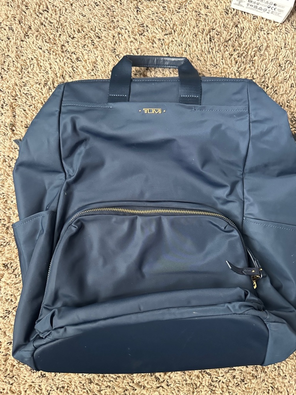 Tumi Navy Blue Backpack with Gold Accents